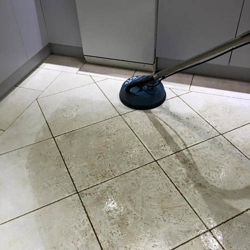 Tile and grout cleaning with a rotary surface cleaner