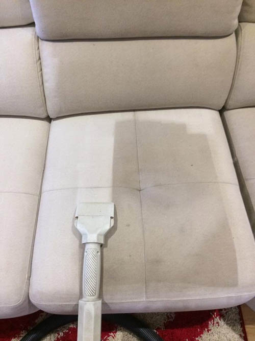 Before and after upholstery cleaning on a fabric lounge